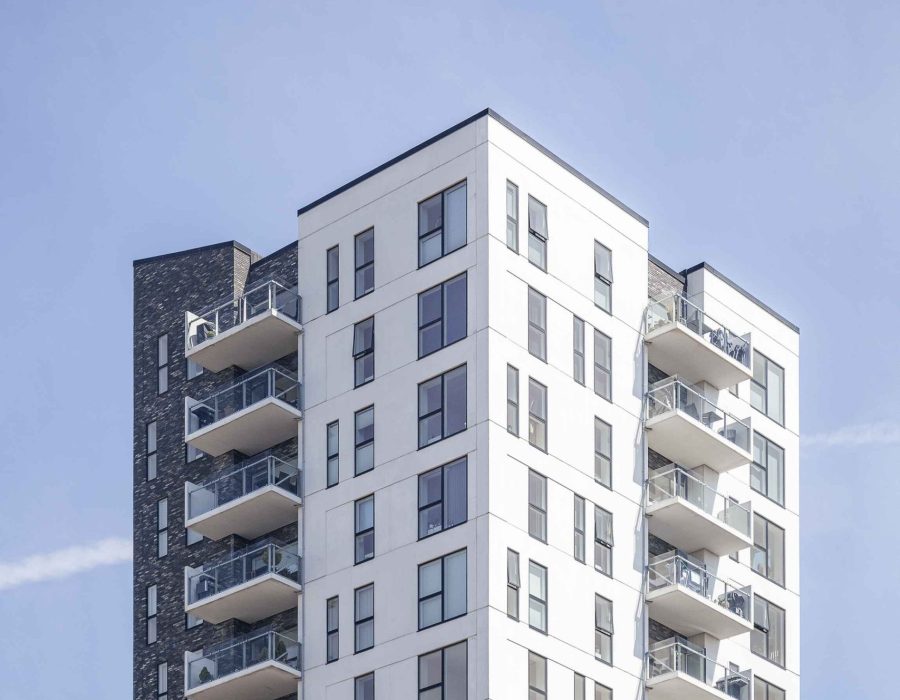 vertical-shot-white-building-clear-sky (1)